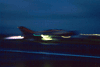  F-7 fighter aircraft takes off at night .